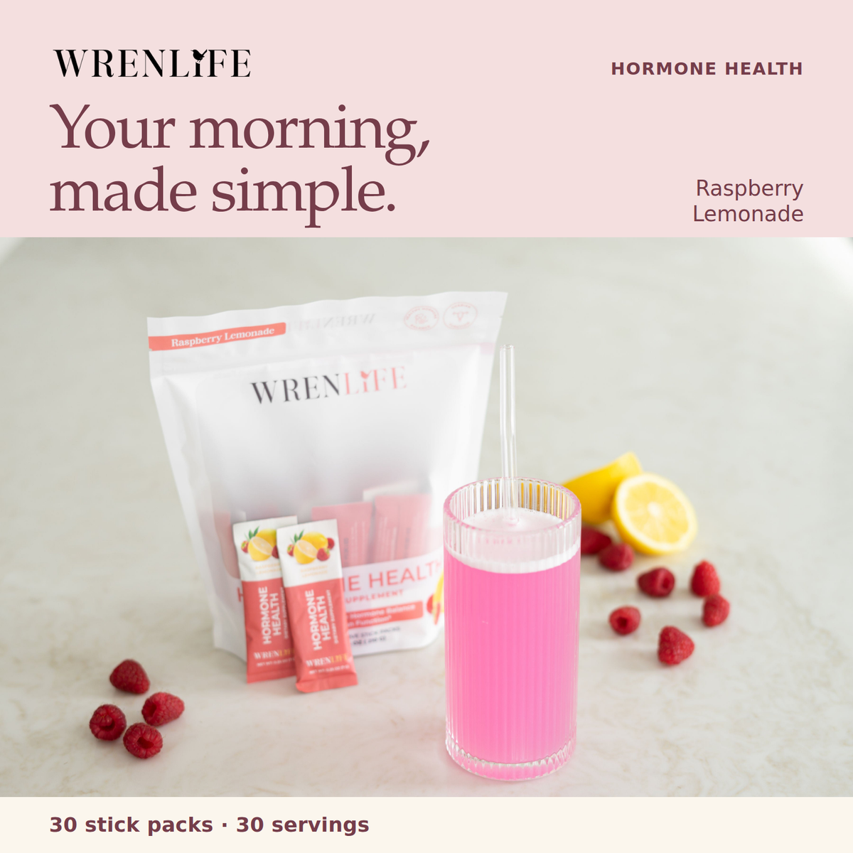WrenLife Hormone Health Raspberry Lemonade: your morning, made simple. Actual bag and stick packs beside a pink drink, raspberries and lemon. Thirty stick packs and thirty servings.
